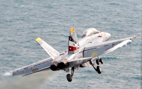 US Navy 120209-N-YB753-046 An F-A-18F Super Hornet assigned to the Bounty Hunters of Strike Fighter Squadron (VFA) 2 launches from the Nimitz-class photo