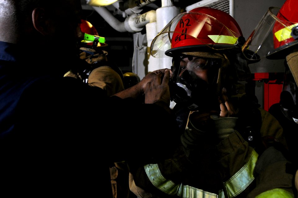 US Navy 120208-N-UT411-049 Sailors don firefighting ensembles during basic damage control training
