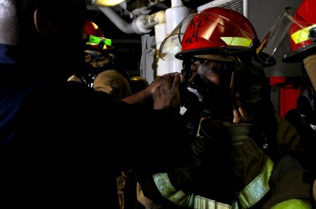 US Navy 120208-N-UT411-049 Sailors don firefighting ensembles during basic damage control training