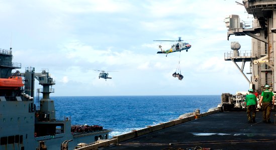 US Navy 120208-N-OY799-174 MH-60S Sea Hawk helicopters from the Eightballers of Helicopter Sea Combat Squadron (HSC) 8 pick up and deliver cargo
