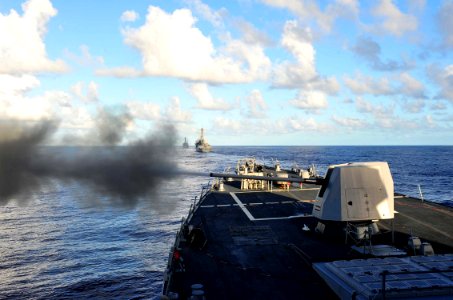 US Navy 120212-N-ED900-597 The MK 45 5-inch gun is fired aboard the guided-missile destroyer USS Pinckney (DDG 91) during a sea power demonstration