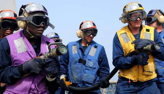 US Navy 120207-N-ZF681-070 Sailors simulate fighting a fire during a flight deck recovery drill aboard the guided-missile destroyer USS Halsey (DDG