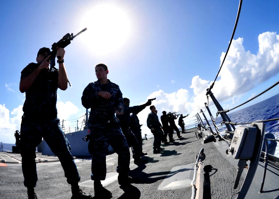 US Navy 120210-N-ED900-831 Sailors aboard the guided-missile destroyer USS Pinckney (DDG 91) receive dry fire and weapon movement training with the