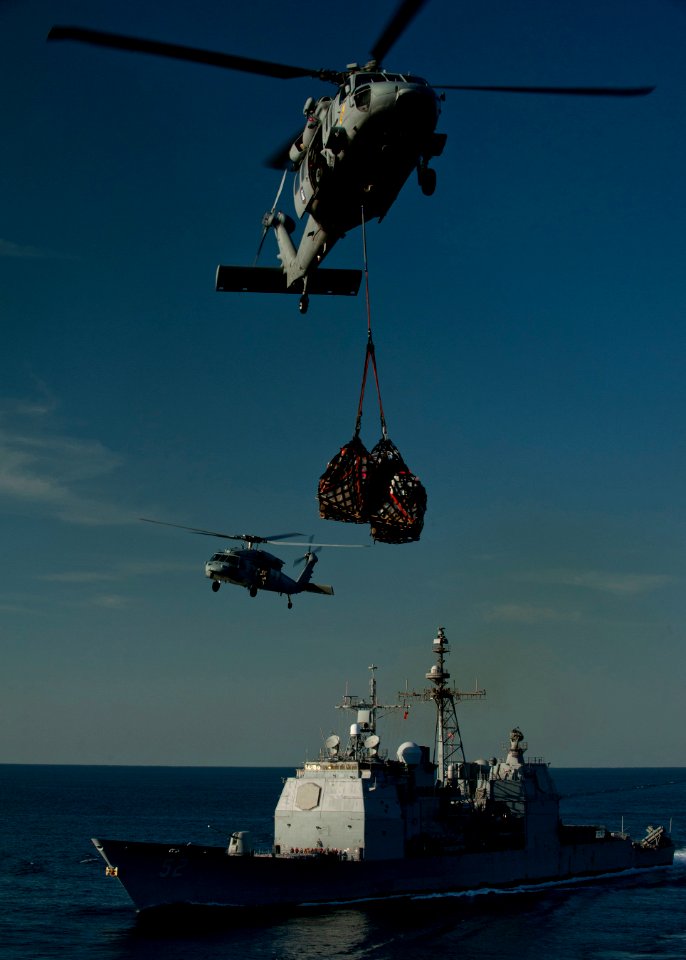 US Navy 120209-N-DR144-286 MH-60S Sea Hawk helicopters assigned to Helicopter Anti-Submarine Squadron (HSC) 23 deliver supplies