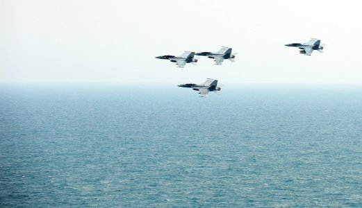 US Navy 120209-N-VO377-356 F-A-18F Super Hornets assigned to the Bounty Hunters of Strike Fighter Squadron (VFA) 2 fly in formation above the Nimit