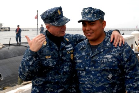 US Navy 120208-N-NK458-007 Master Chief Petty Officer of the Navy (MCPON) Rick D. West speaks with Logistics Specialist 3rd Class David Terrones, f photo