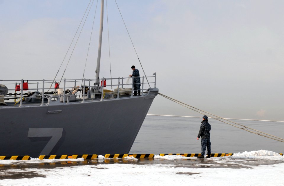 US Navy 120214-N-MU720-007 Sailors assigned to the mine countermeasure ship USS Patriot (MCM 7) work on the bow following Patriot's arrival to Hako