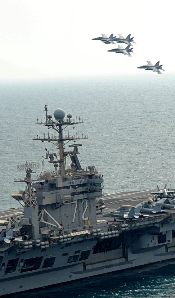 US Navy 120209-N-VO377-346 F-A-18F Super Hornets assigned to the Bounty Hunters of Strike Fighter Squadron (VFA) 2 fly in formation above the Nimit