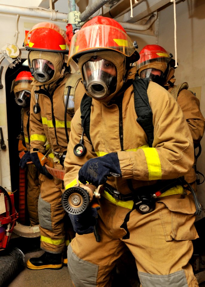 US Navy 120209-N-ZR940-019 Sailors assigned to the Nimitz-class aircraft carrier USS Harry S. Truman (CVN 75) simulate combating a fire during a ge