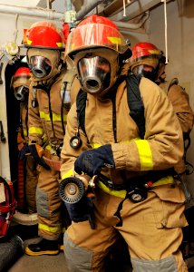 US Navy 120209-N-ZR940-019 Sailors assigned to the Nimitz-class aircraft carrier USS Harry S. Truman (CVN 75) simulate combating a fire during a ge
