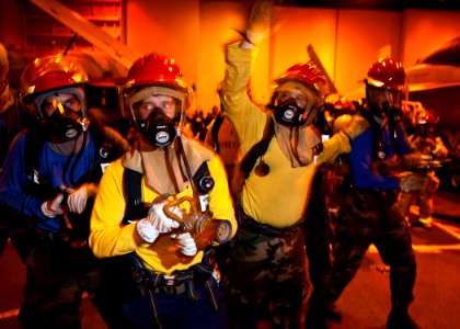 US Navy 120214-N-BT887-106 A Sailor signals to the on-scene leader during a general quarters training exercise aboard the Nimitz-class aircraft car