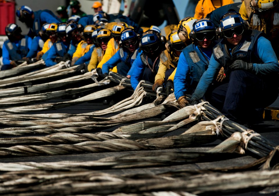 US Navy 120210-N-DR144-172 Air Department Sailors rig barricades during flight deck drills aboard the Nimitz-class aircraft carrier USS Carl Vinso