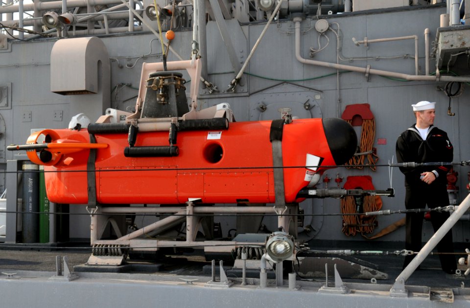 US Navy 120214-N-MU720-050 Mineman 3rd Class Jeffery Skeins, assigned to the mine countermeasure ship USS Patriot (MCM 7), stands by to give a pres