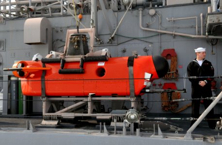 US Navy 120214-N-MU720-050 Mineman 3rd Class Jeffery Skeins, assigned to the mine countermeasure ship USS Patriot (MCM 7), stands by to give a pres