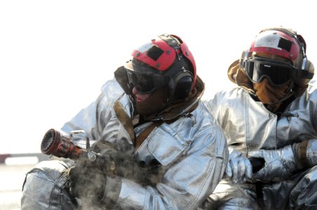 US Navy 120210-N-ZZ999-270 Sailors simulate combating an aircraft fire during flight deck firefighting drills