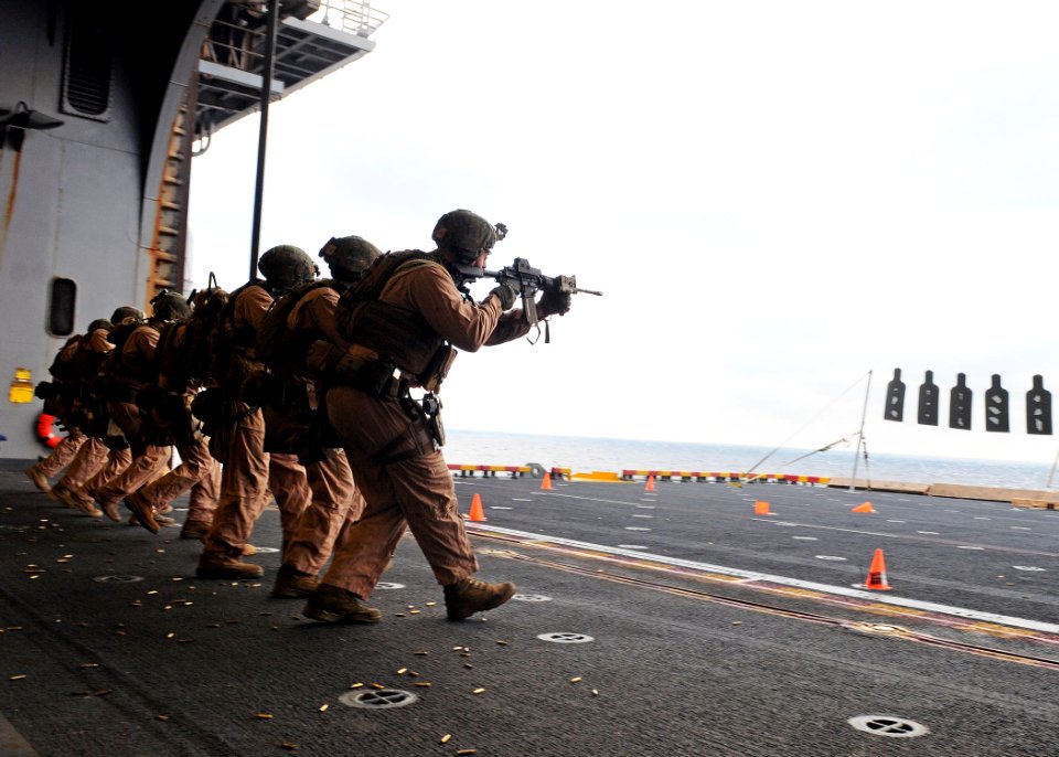 US Navy 120209-N-ZZ999-021 Marines assigned to Force Reconnaissance Unit engage targets on the aircraft elevator of the multipurpose amphibious ass