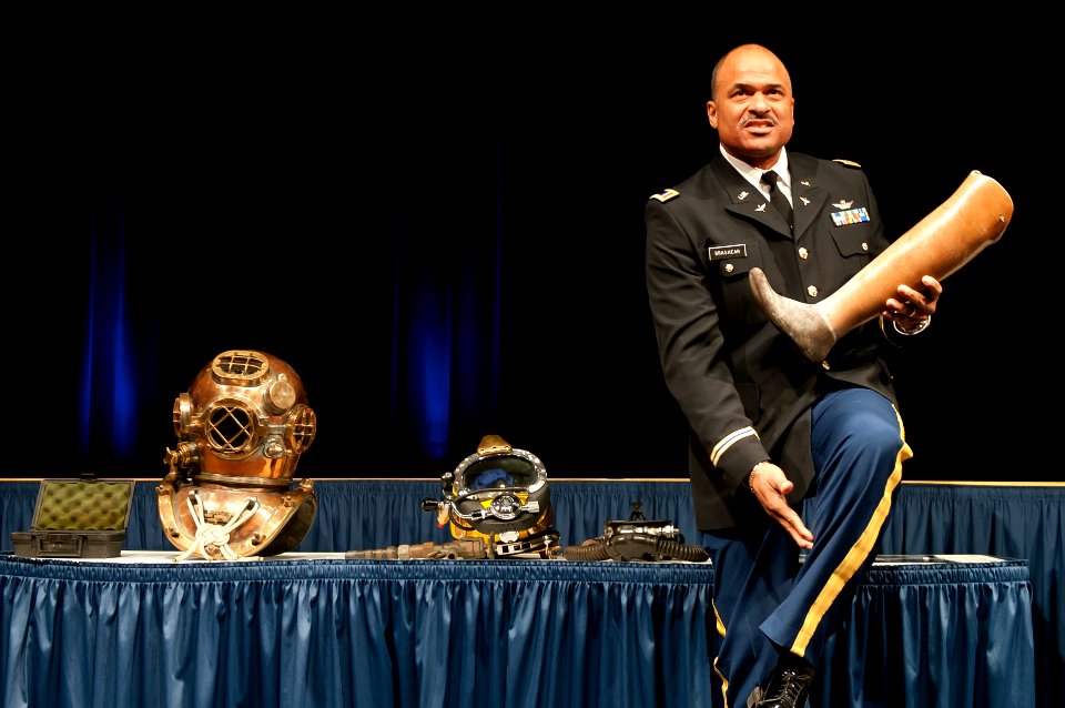 US Navy 120210-N-PM781-002 Army Chief Warrant Officer Phillip Brashear, son of Master Chief Carl Brashear, holds his father's prosthetic leg as he