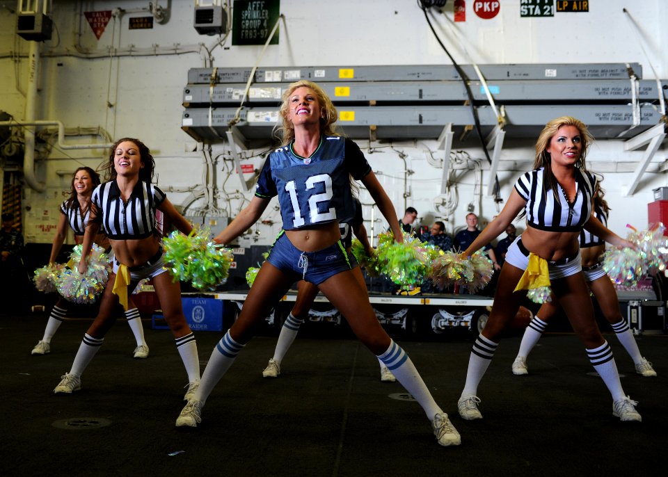US Navy 120213-N-KD852-106 The Seattle Seahawks cheerleaders, the Sea Gals, perform for Sailors and Marines aboard the amphibious assault ship USS