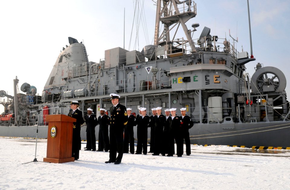 US Navy 120214-N-MU720-003 Lt. Cmdr. Suzanne Schang, commanding officer of the mine countermeasures ship USS Patriot (MCM 7), prepares to address m