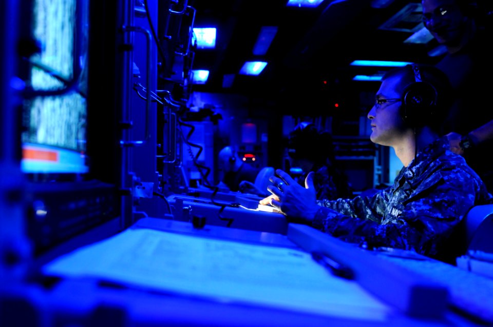 US Navy 120211-N-BC134-150 Sonar Technician Surface 3rd Class Landon Walker stands watch in the combat information center aboard the guided-missile