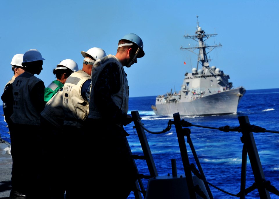US Navy 120212-N-ED900-779 Safety personnel aboard the guided-missile destroyer USS Pinckney (DDG 91) observe fueling operations during a replenish