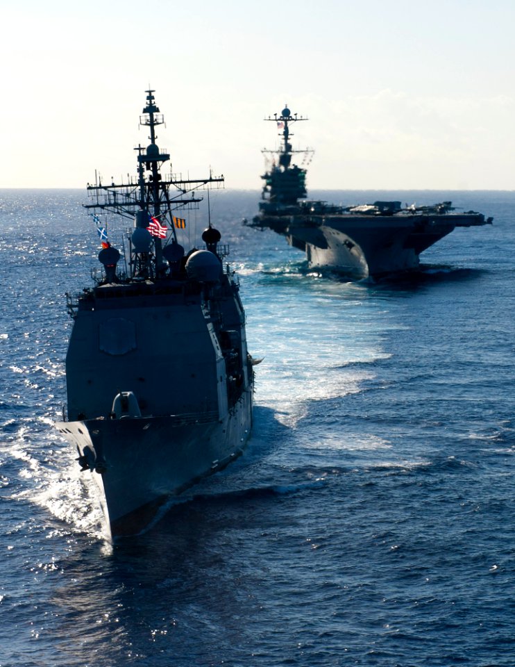 US Navy 120214-N-OY799-627 The Ticonderoga-class guided-missile cruiser USS Mobile Bay (CG 53) and the Nimitz-class aircraft carrier USS John C. St