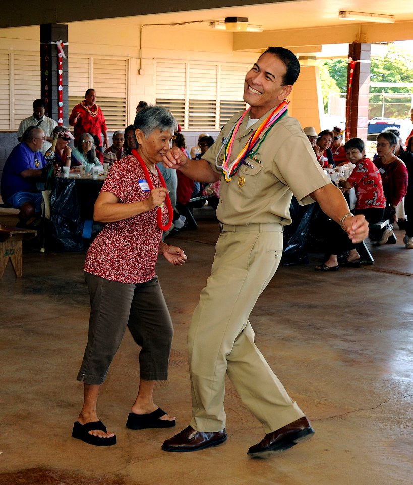 US Navy 120210-N-YU572-089 Aviation Maintenance Master Chief Willie Canaya, Command Master Chief of the Pacific Missile Range Facility, dances with