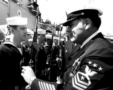 US Navy 800322-N-XXXX0-001 Master Chief Petty Officer of the Navy (MCPON) Tom Crow inspects the troops at the commissioning ceremony for the Spruance-class destroyer USS Deyo (DD 989)