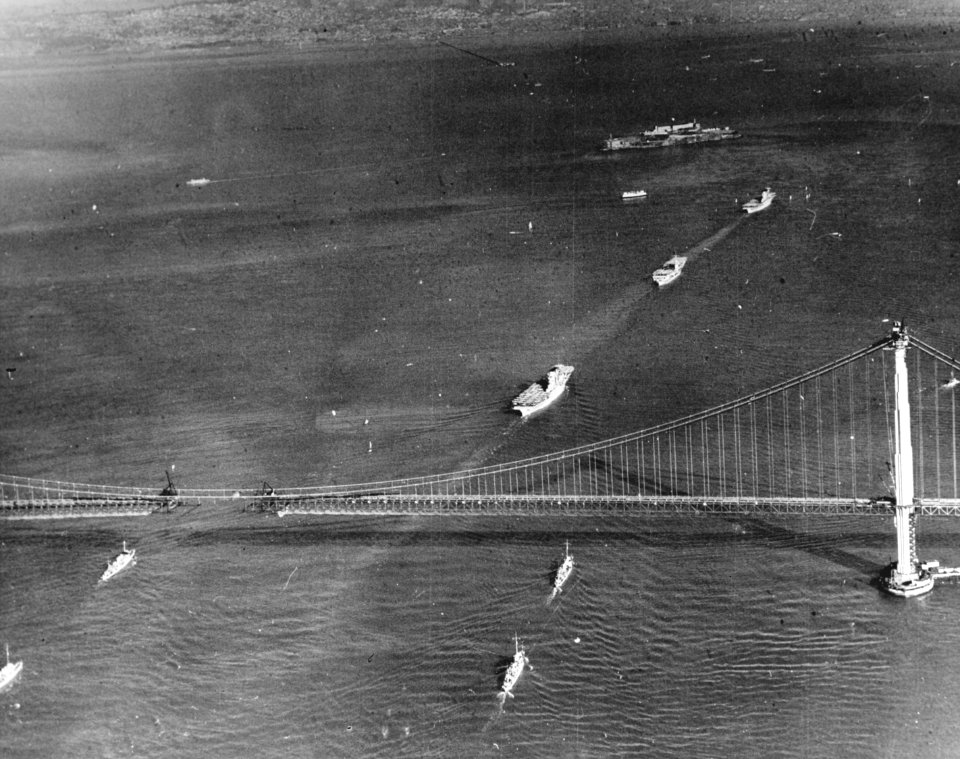 US Navy aircraft carriers passing under the Golden Gate Bridge in November 1936
