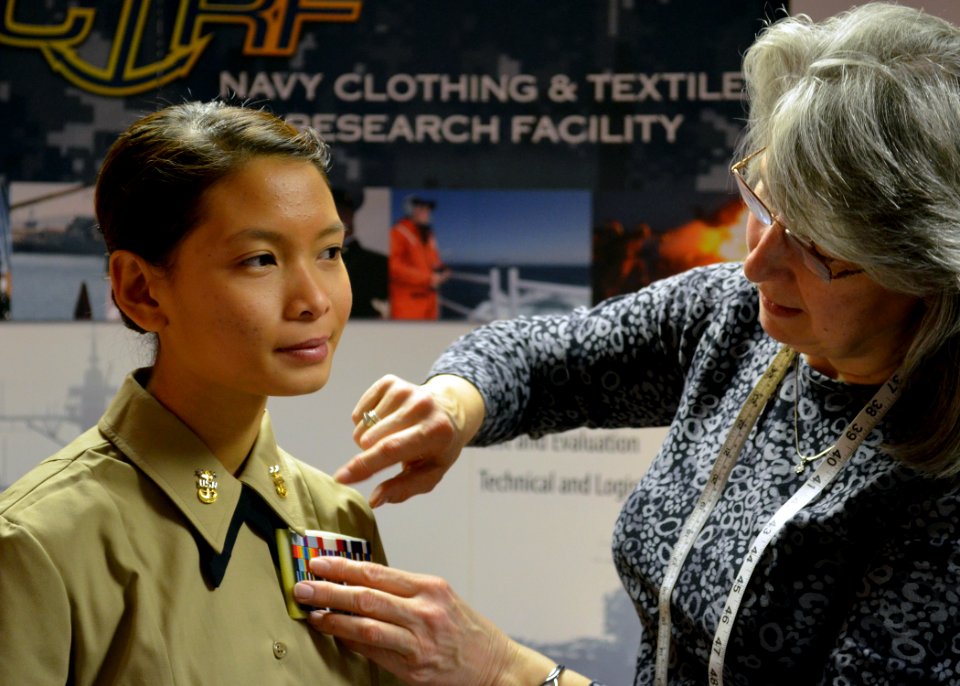 US Navy 120213-N-SH935-053 Airman Sang Nguyen, assigned to USS Constitution, is evaluated in a sample uniform