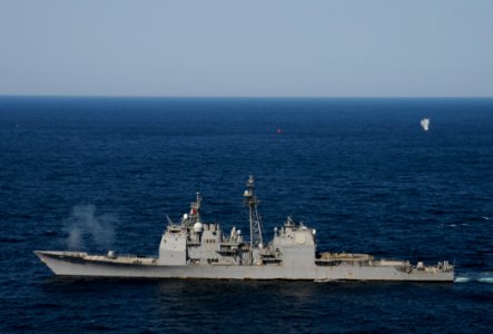 US Navy 120214-N-BC134-698 The guided-missile cruiser USS Bunker Hill (CG 52) fires an MK-45 5 inch-54-caliber lightweight gun during a pre-action
