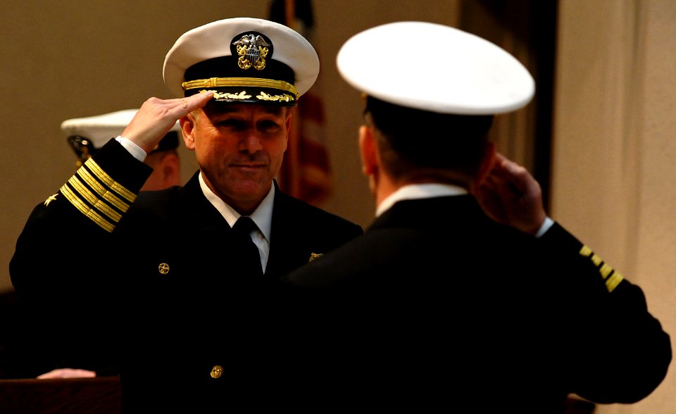 US Navy 120216-N-NW827-138 Capt. Mark Davis salutes Capt. Wesley Guinn at a change of command ceremony at Naval Support Activity Naples