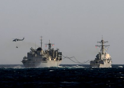 US Navy 120214-N-BC134-213 An MH-60S Sea Hawk helicopter transfers supplies