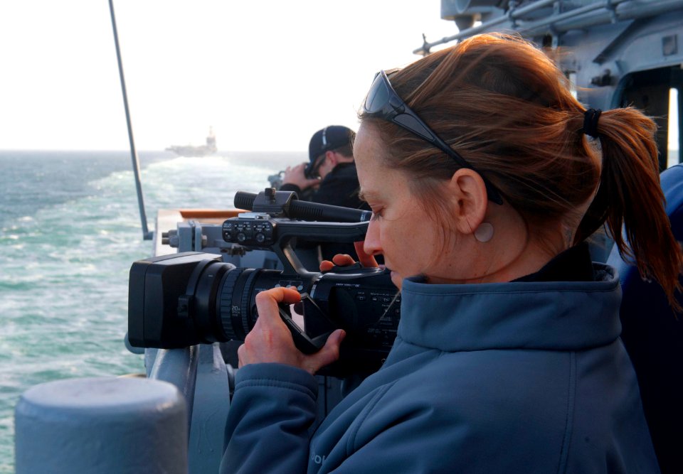 US Navy 120214-N-VY256-020 NBC News producer Courtney Kube records the view outside the pilothouse of the Ticonderoga-class guided-missile cruiser