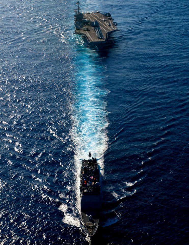 US Navy 120214-N-OY799-716 The Ticonderoga-class guided-missile cruiser USS Mobile Bay (CG 53) and the Nimitz-class aircraft carrier USS John C. St