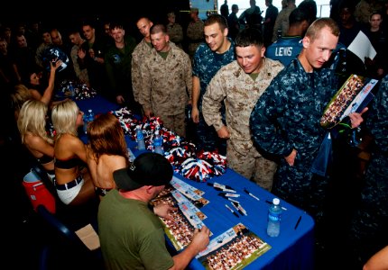 US Navy 120213-N-DX615-606 Seattle Seahawks cheerleaders, the Sea Gals, and comedian Brian Ricci greet Sailors and Marines aboard the amphibious as