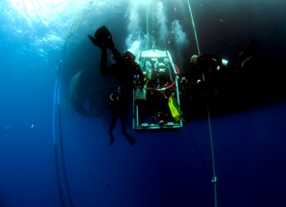 US Navy divers, alongside the Joint POW-MIA Accounting Command, search for an unaccounted-for service member who went missing during World War II 121019-N-OT964-024