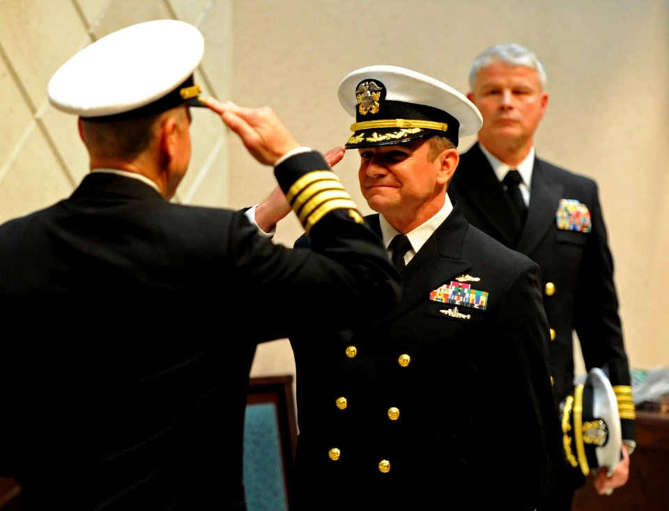 US Navy 120216-N-AQ172-148 Capt. Wesley Guinn salutes Capt. Mark Davis at a change of command ceremony held at Naval Support Activity Naples