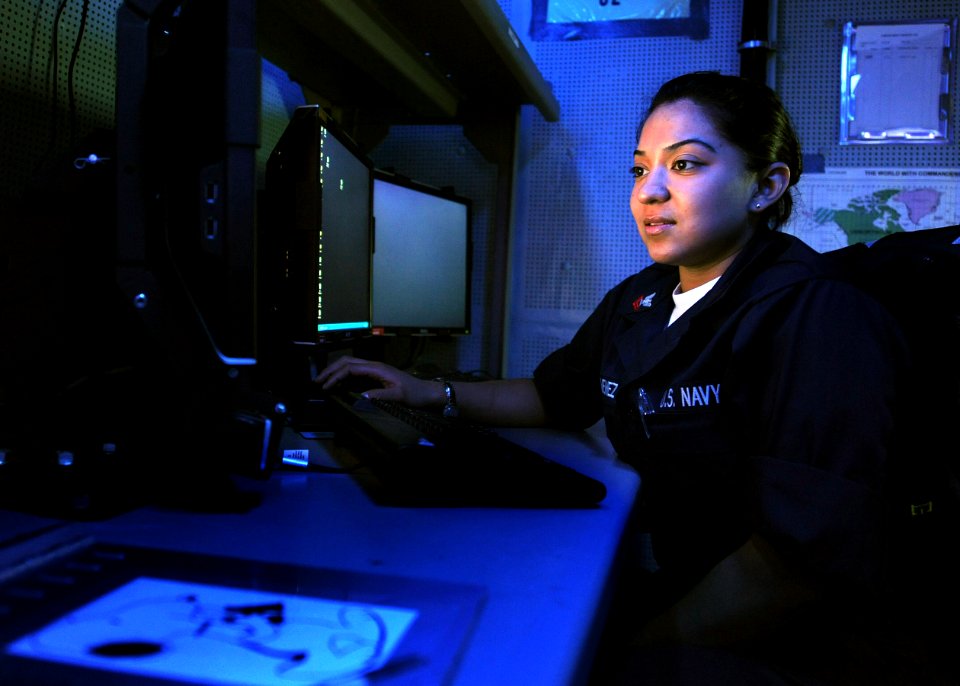 US Navy http-www.navy.mil-management-photodb-photos-100603-N-5082P-003 Intelligence Specialist 2nd Class Dee A. Jimenez reviews imagery in the Carrier Intelligence Center aboard the aircraft carrier USS Enterprise (CVN 65)