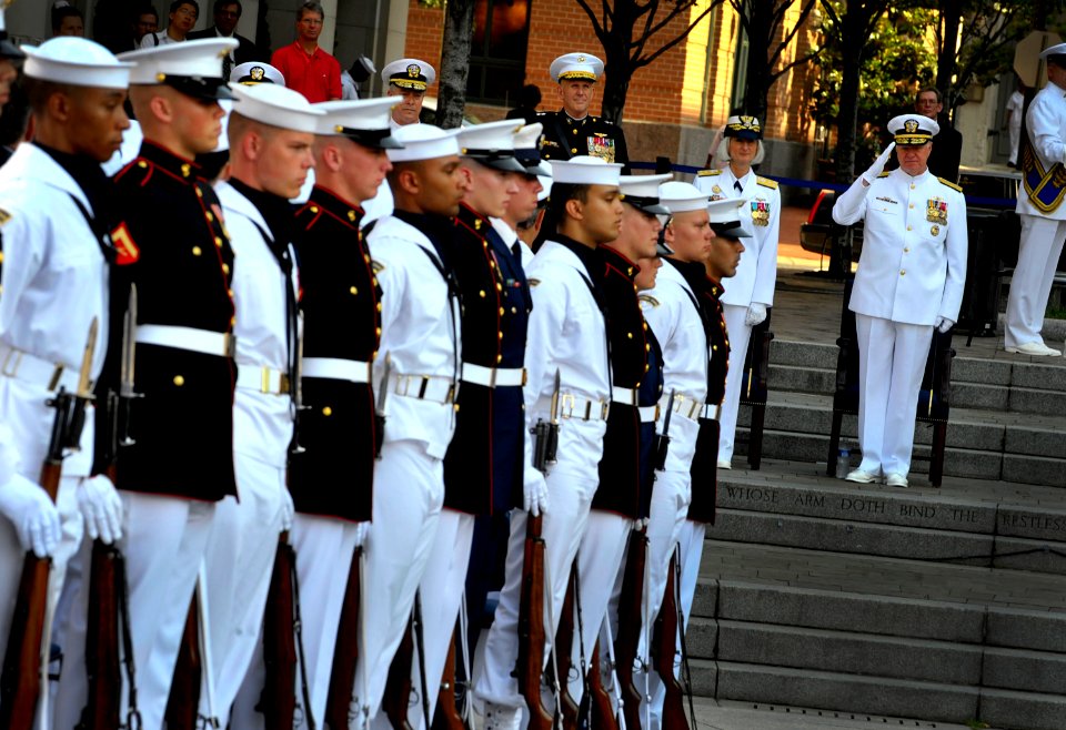 US Navy Chief of Naval Operations (CNO) Adm. Gary Roughead renders honors during a ceremony at the U.S. Navy Memorial commemorating the 68th anniversary of the Battle of Midway