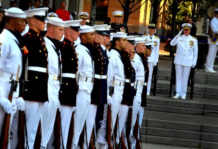 US Navy Chief of Naval Operations (CNO) Adm. Gary Roughead renders honors during a ceremony at the U.S. Navy Memorial commemorating the 68th anniversary of the Battle of Midway