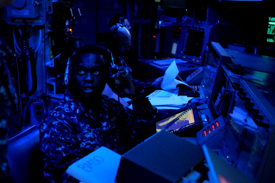US Navy 120214-N-IO627-007 Lt. j.g. Jhon Alseide, ballistic-missile defense officer aboard the guided-missile destroyer USS Stethem (DDG 63), respo
