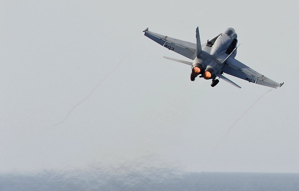 US Navy 120216-N-VO377-155 An F-A-18C Hornet assigned to the Blue Blasters of Strike Fighter Squadron (VFA) 34 launches from the flight deck of the