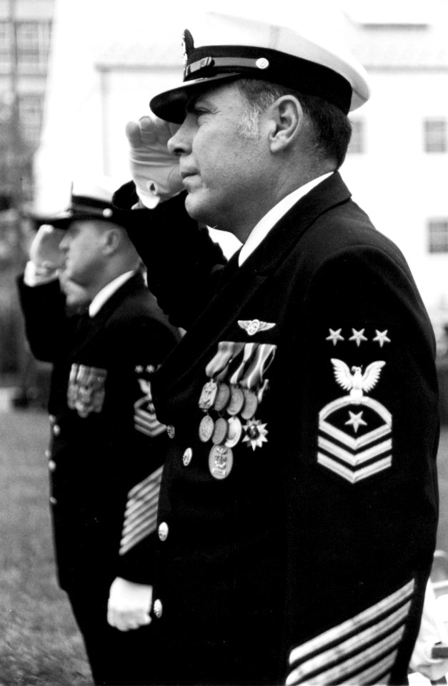 US Navy 790928-N-0000X-002 Master Chief Petty Officer of the Navy (MCPON) Thomas S. Crow and MCPON Robert J. Walker, rear, render hand salutes