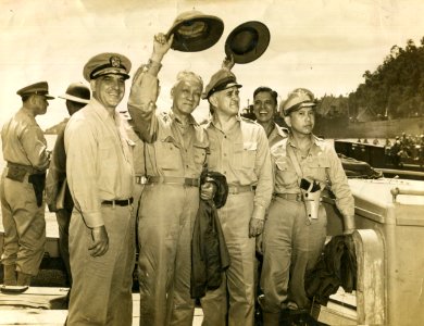 US Navy officers with Sergio Osmeña and Carlos P. Romulo