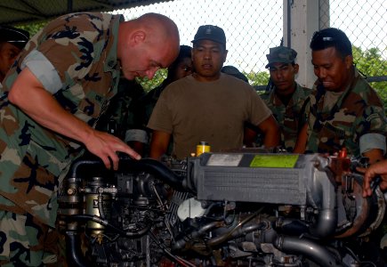 US Navy Chief Engineman Edward Young inspects the inner workings of a diesel engine during a subject matter expert exchange with Panamanian Defense Forces in Balboa-Rodman, Panama