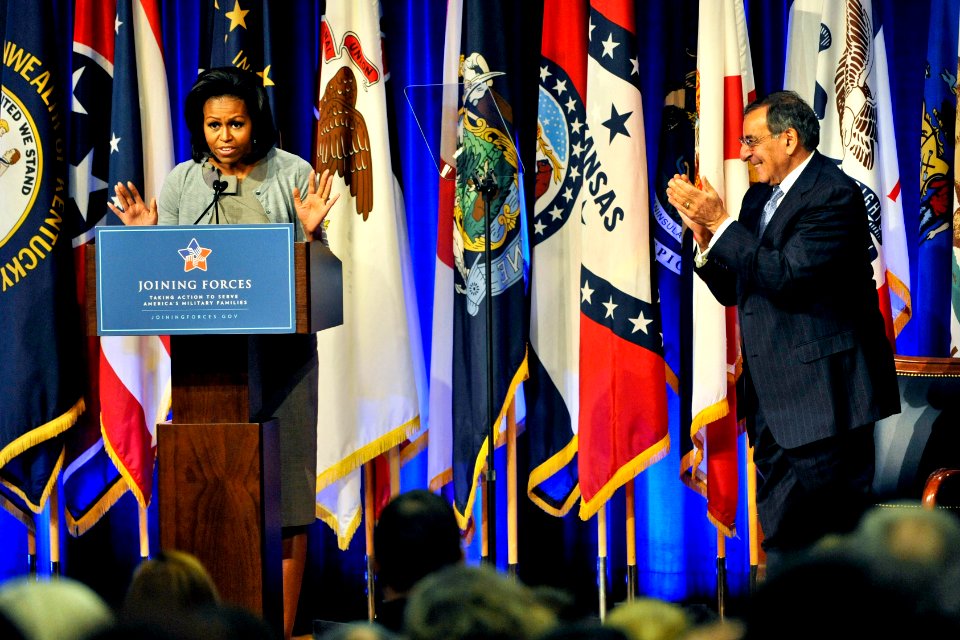 US Navy 120215-D-NI589-386 Secretary of Defense (SECDEF) Leon E. Panetta applauds first lady Michelle Obama as she is introduced during the rollout