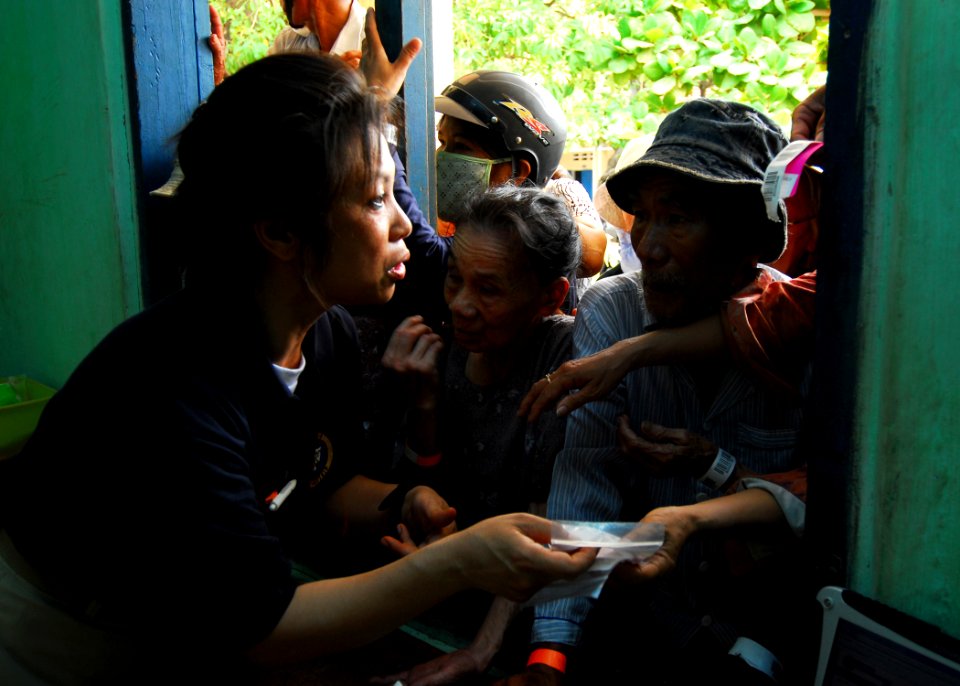 US Navy http-www.navy.mil-management-photodb-photos-100603-N-4044H-223 Lt. Cmdr. Cha Vu istributes medicine to local Vietnamese patients during a Nhon Binh medical civic action program