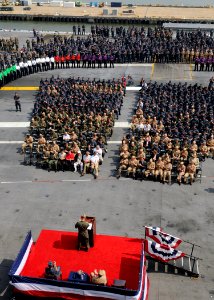 US Navy Sailors and guests applaud veterans of the Battle of Midway during a Battle of Midway commemoration ceremony aboard the aircraft carrier USS George H.W. Bush (CVN 77)