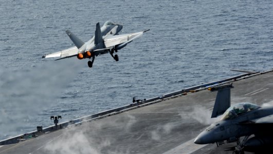 US Navy 120216-N-VO377-376 An F-A-18C Hornet assigned to the Blue Blasters of Strike Fighter Squadron (VFA) 34 launches from the flight deck of the